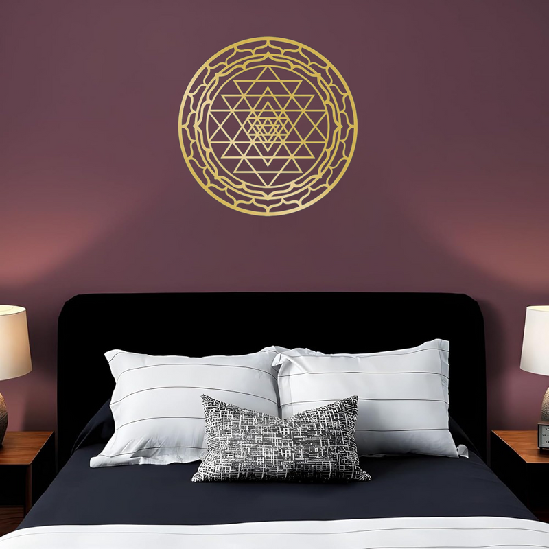 Sacred geometry metal wall art shown above a dining table