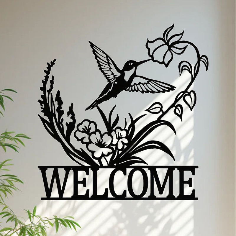 Handcrafted metal hummingbird and flowers wall decor detail